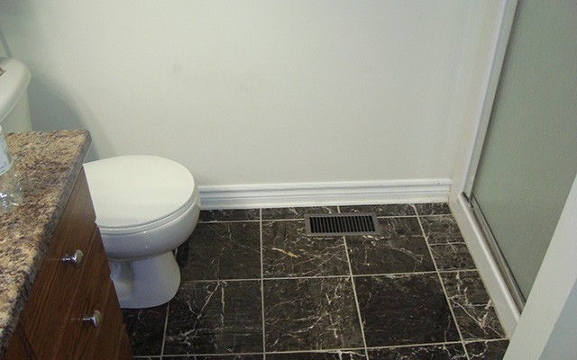 a toilet next to a sink in a bathroom