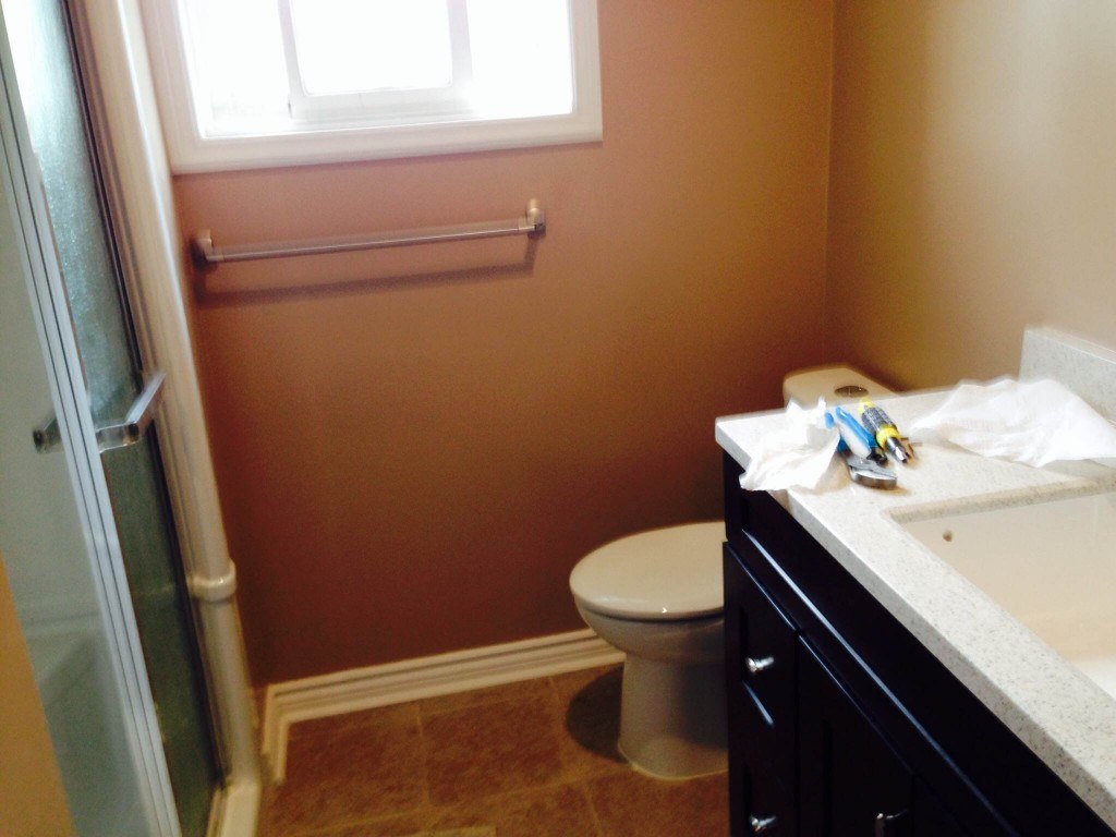 white ceramic sink near white wooden framed glass window